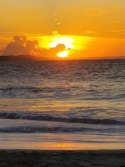 Sunset behind the clouds